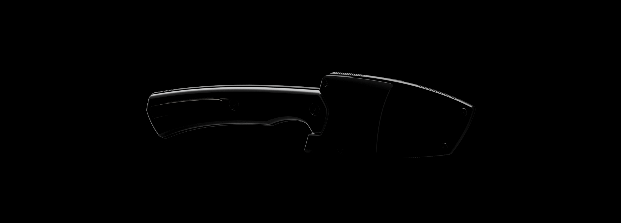 Dimly lit knife and sheath with primarily a silhouette visible